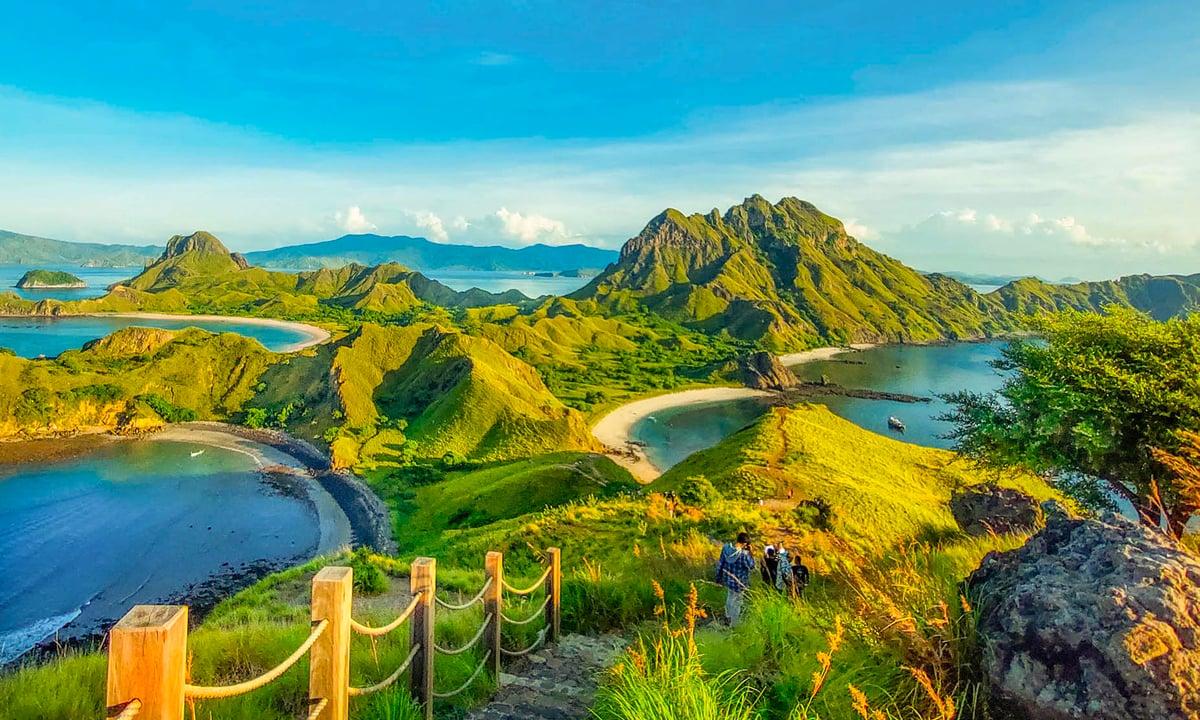 Green hills and bays of Padar Island at sunrise