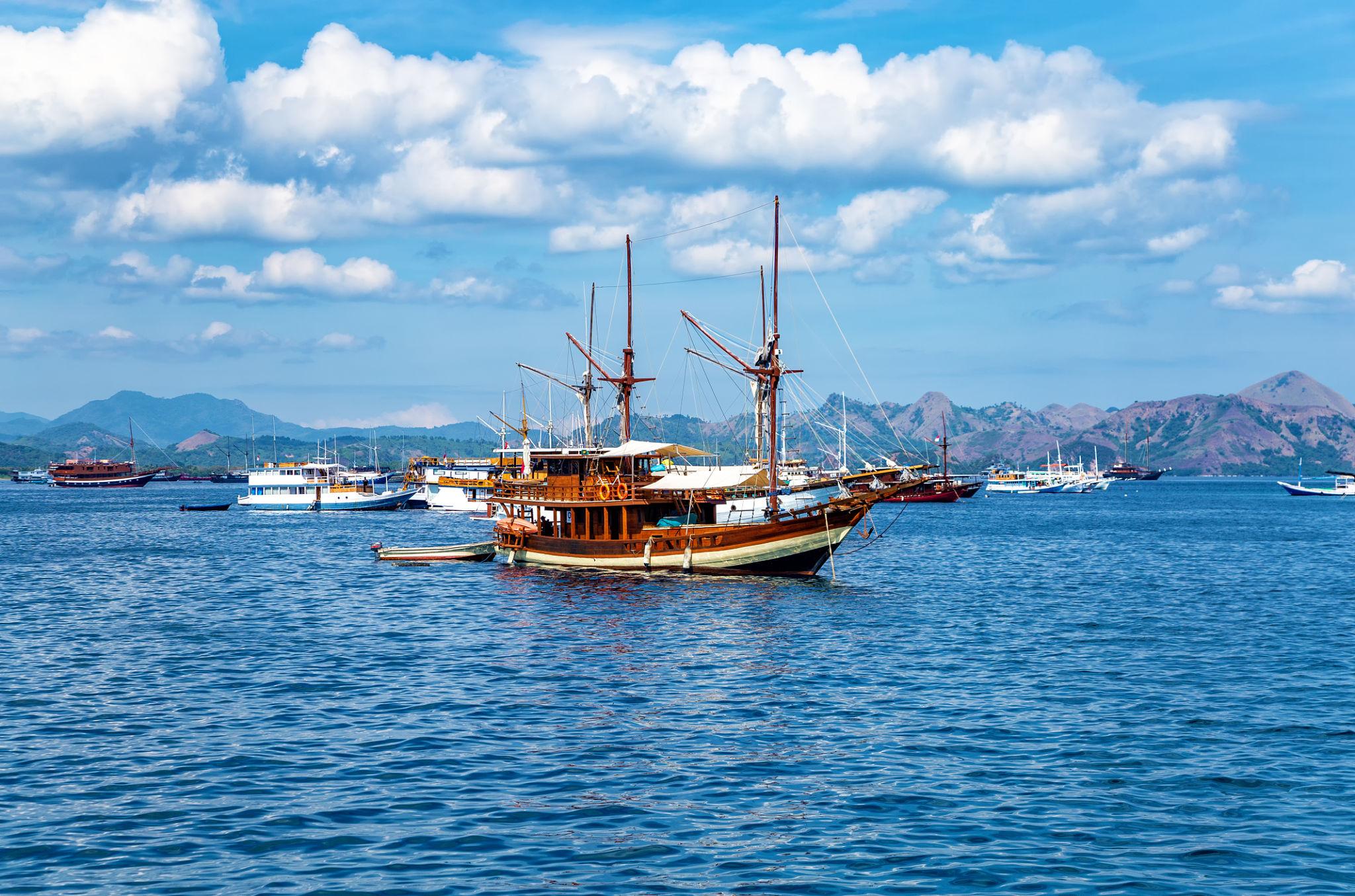 Wooden phinisi liveaboard boat sailing near Labuan Bajo